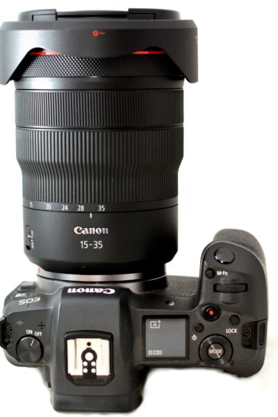 Top view of Canon EOS R full frame mirrorless digital camera with attached Canon rf 15-35mm lens.